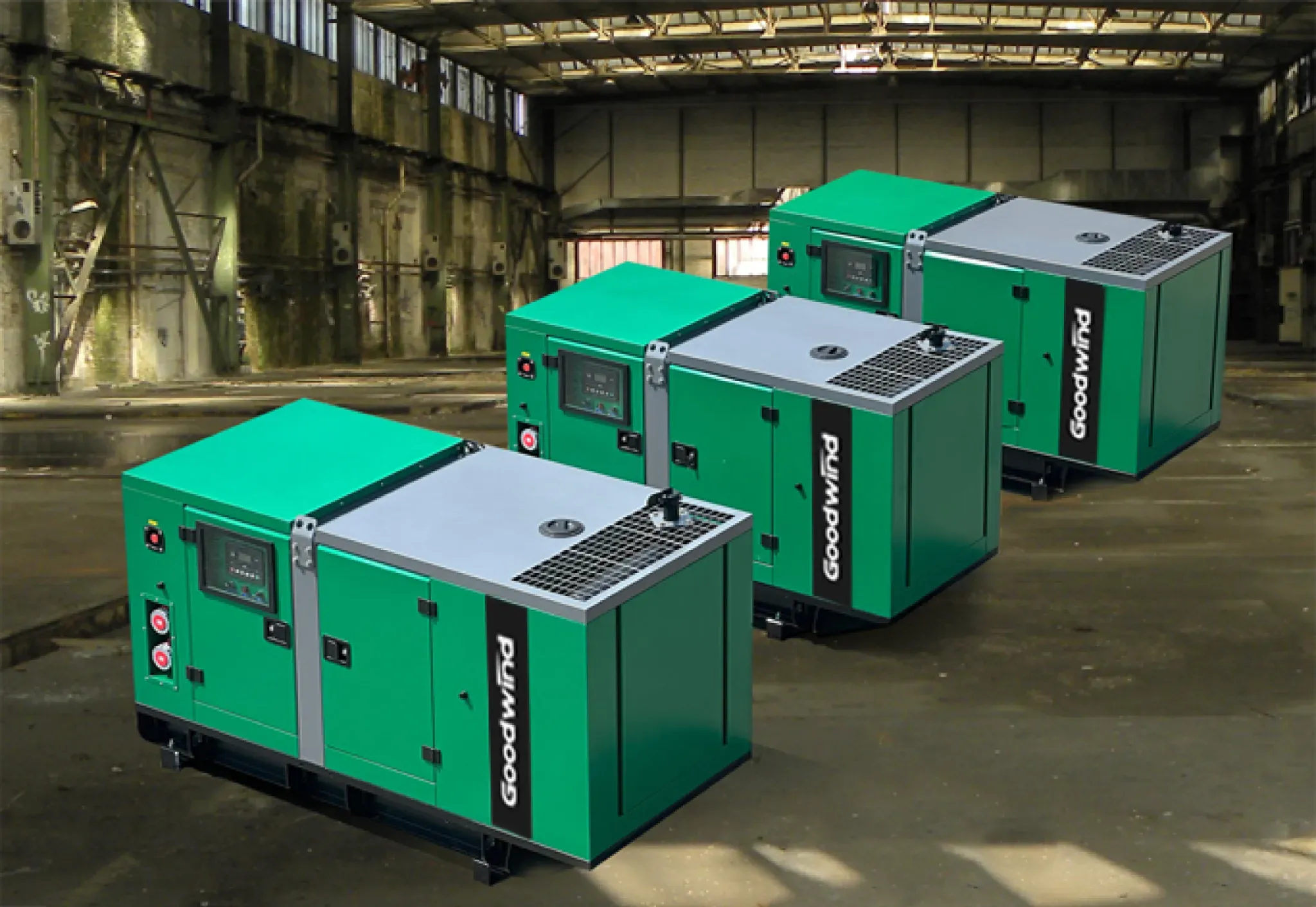Three Goodwind compact silent generator sets in a manufacturing workshop
